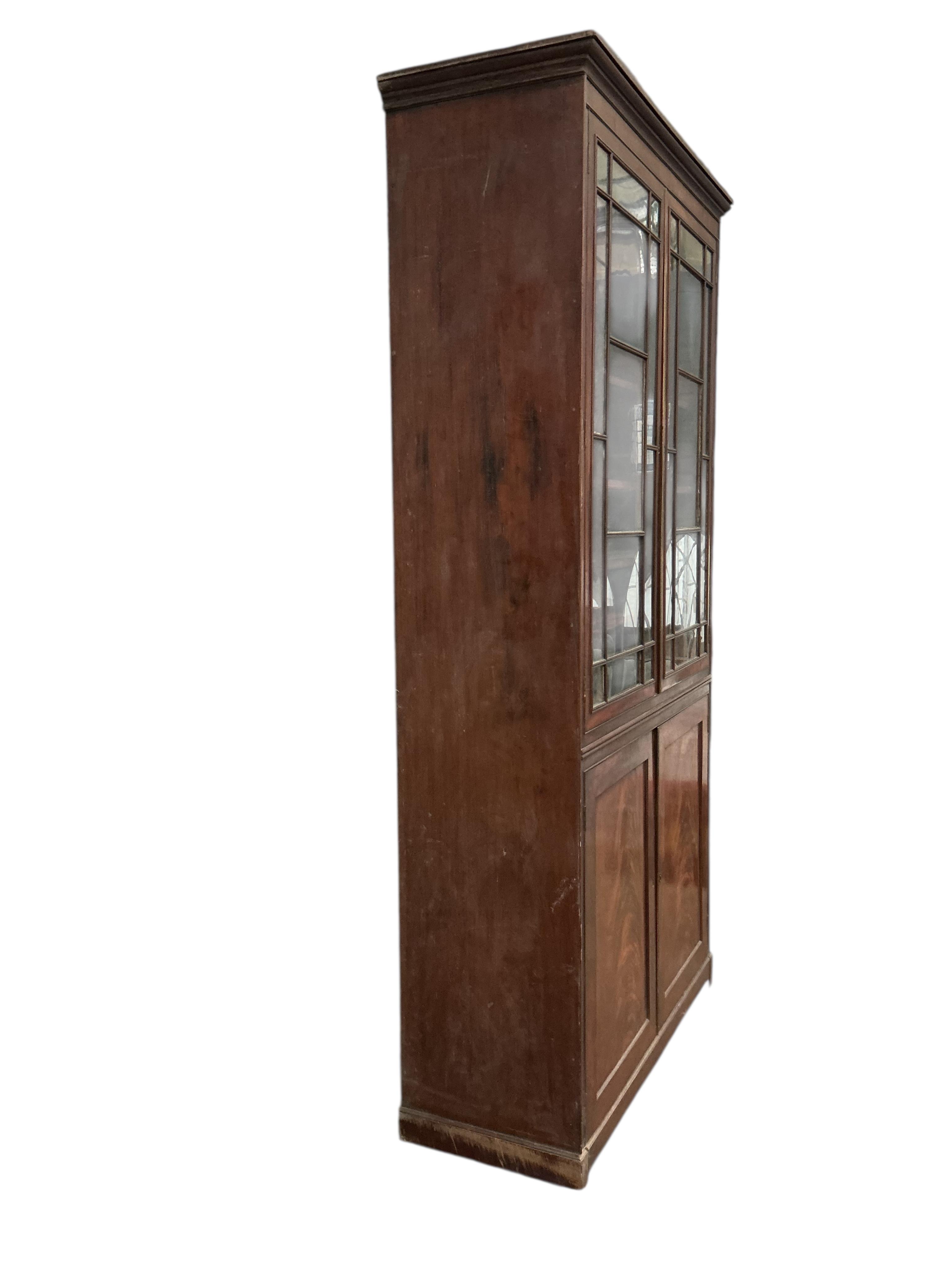 A George III mahogany bookcase, width 112cm, depth 42cm, height 225cm